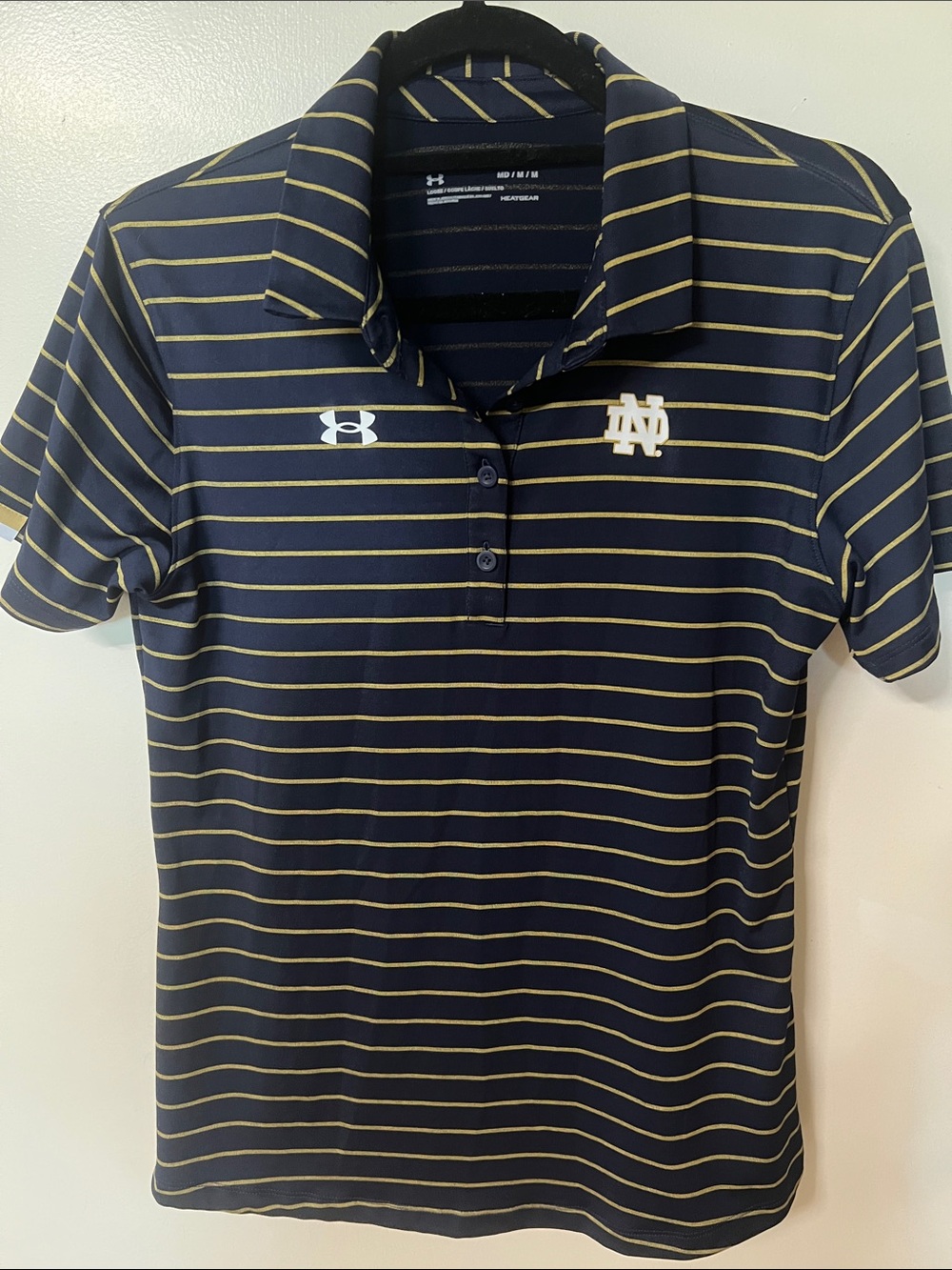 Under Armour Women’s Navy and Gold Striped Polo with ND Logo